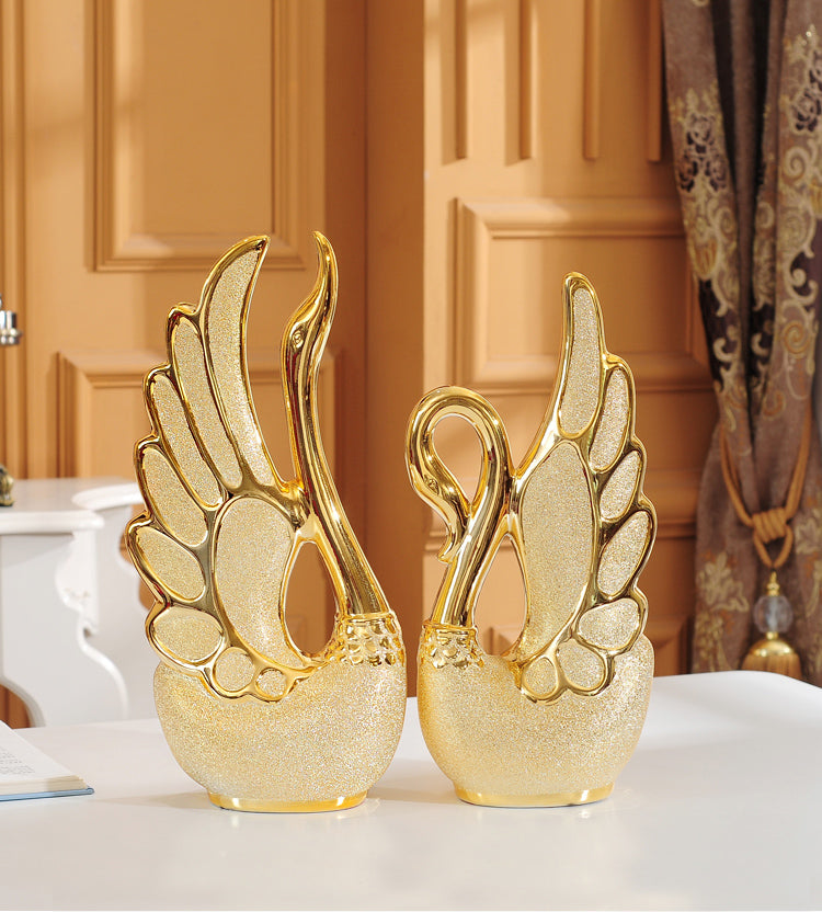 Gold-plated swan ornaments