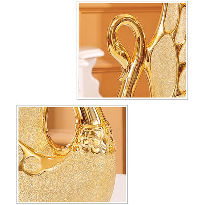 Gold-plated swan ornaments